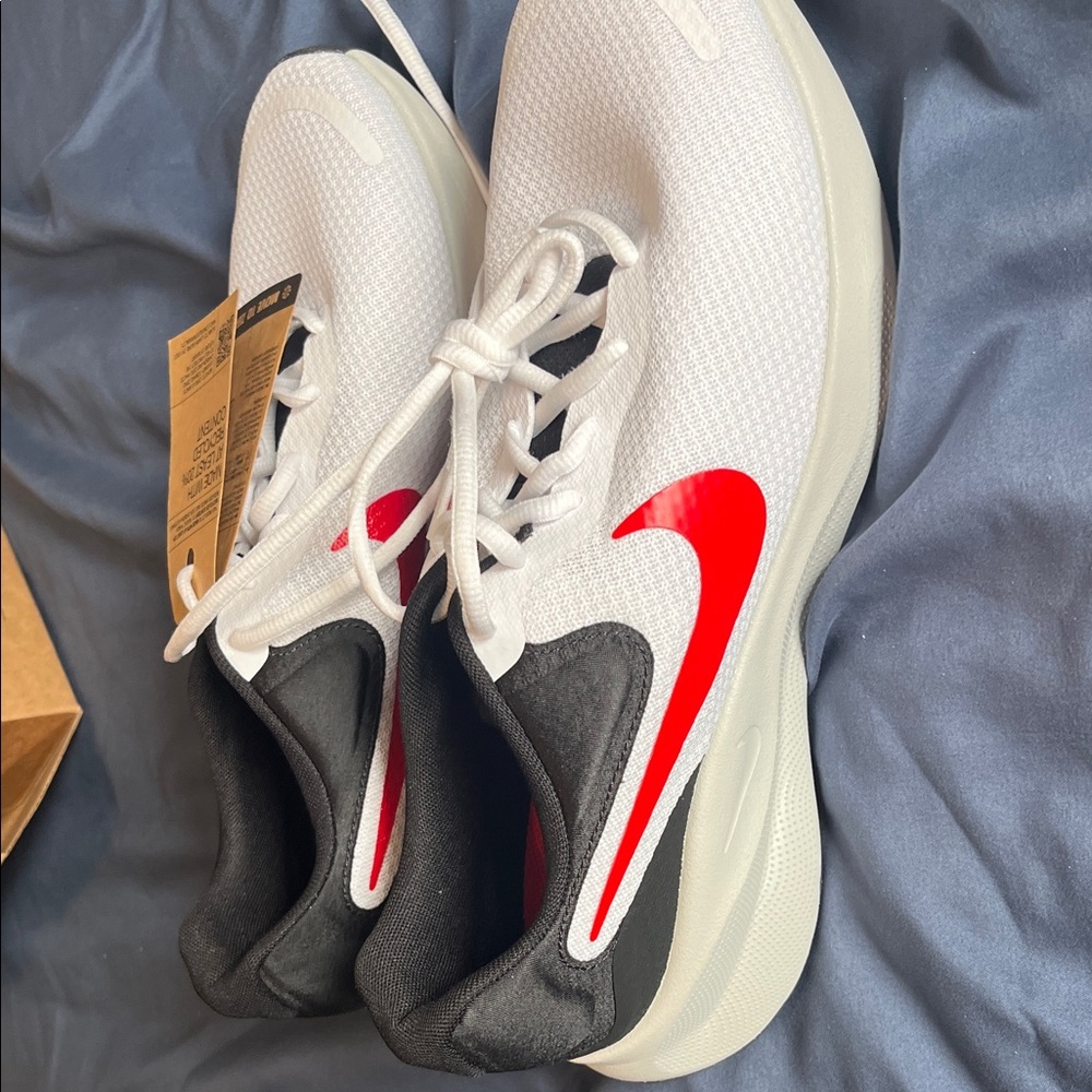 Nike Revolution 7 in White, Red, and Black